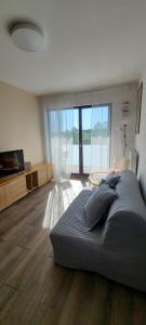 a bedroom with a large bed and a large window at WellSituated 1 Bedroom Condo in Warsaw freeparking in Warsaw