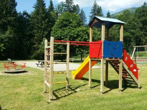 a playground with a slide and a slideintend at Appartement de 3 chambres avec jardin et wifi a Hauteluce a 2 km des pistes in Hauteluce