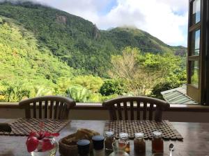 a table with a view of a mountain at 2 bedrooms villa with sea view enclosed garden and wifi at Victoria Zig Zag Ward 6 km away from the beach in Victoria