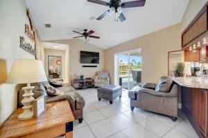 a living room with couches and a ceiling fan at Marco Beach Escape in Marco Island