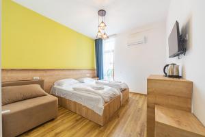 Postel nebo postele na pokoji v ubytování Hotel mia Telavi