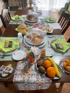 a table with plates of food and fruit on it at Rabatè in Agrigento