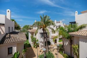 a view of the courtyard of a villa with palm trees at VACATION MARBELLA I 300 SQM Penthouse, Private Swimming pool, BBQ, WiFi in Marbella