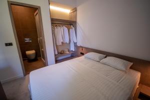 Letto o letti in una camera di Bloom Suites