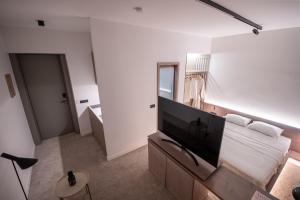 TV o dispositivi per l'intrattenimento presso Bloom Suites