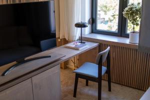 TV o dispositivi per l'intrattenimento presso Bloom Suites