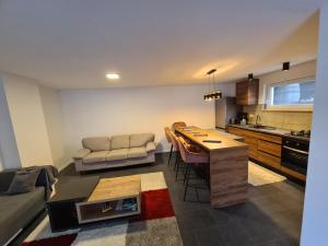 a kitchen and living room with a couch and a table at Villa Ska in Pula +44 photos