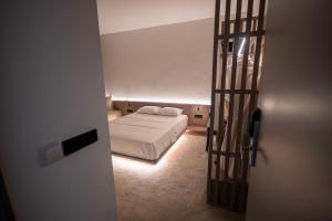 Letto o letti in una camera di Bloom Suites