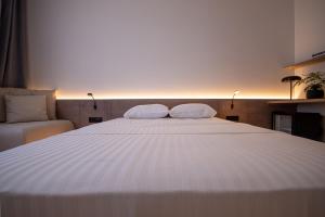 Letto o letti in una camera di Bloom Suites