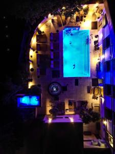 an overhead view of a building with a swimming pool at night at Elexus Predeal in Predeal