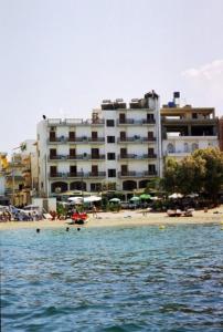 a view of a beach with a hotel and a building at Elena Beach in Chania