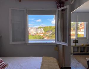 Postel nebo postele na pokoji v ubytování somriu Apartament Fenals Platja + 21 fotografií