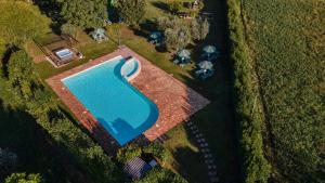 an overhead view of a swimming pool in a field at Residence Il Melograno in Manerba del Garda
