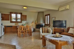 a large living room with a kitchen and a living room at ZeusPlace Olympus Olive Country House 4 in Leptokaria