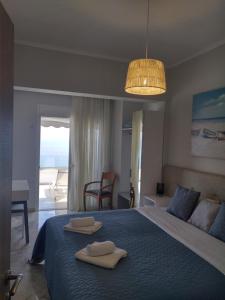 Ένα ή περισσότερα κρεβάτια σε δωμάτιο στο Panorama Sea View