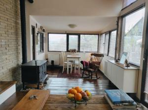 a living room with a table and a bowl of fruit at Kikety Paradise in Kiketʼi