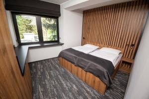 Ένα ή περισσότερα κρεβάτια σε δωμάτιο στο Hotel Kras