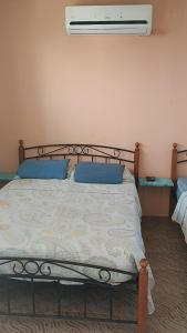 Cama ou camas em um quarto em Rancho Juancho