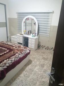 a bathroom with a sink and a mirror at Duraidi in Amman