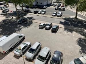 an aerial view of a parking lot with parked cars at Live it up Marvila in Lisbon