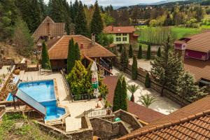 an aerial view of a house with a swimming pool at Safari Village Velingrad in Velingrad