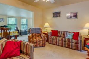 a living room with two couches and a table at Lake of the Ozarks Vacation Rental with Boat Dock! in Edwards