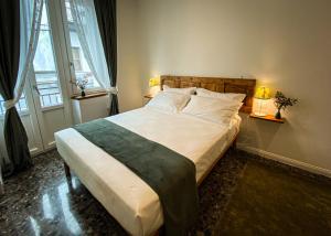 Postel nebo postele na pokoji v ubytování Taffetà b&b
