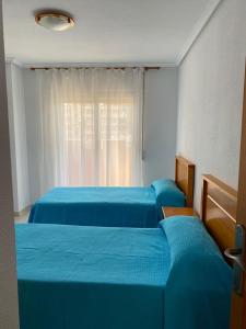 A bed or beds in a room at La Manga - Castillo de Mar 2A - Mar menor