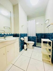 a bathroom with a toilet and a sink at Comfy home with large terrace five minutes from ocean in Los Cristianos