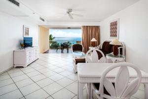 a living room with a view of the ocean at Elegant Studio in Lowlands - 55 sqm - Pool in Lowlands
