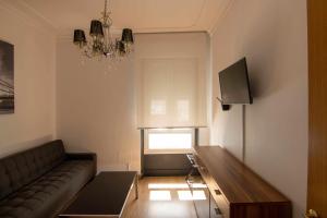 Televisyen dan/atau pusat hiburan di Apartamento Londres