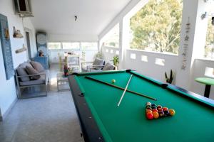 a pool table with balls in a living room at Harmony Villa in Kalymnos