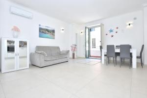 a living room with a couch and a table at One bedroom appartement at Minori 400 m away from the beach with wifi in Minori