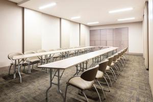 an empty conference room with tables and chairs at Hotel Cabrera Imperial By key 33 in Bogotá