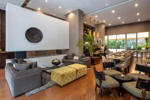 a living room with couches and chairs and tables at Hotel Cabrera Imperial By key 33 in Bogotá