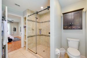 a bathroom with a shower stall and a toilet at Pet-Friendly Naples Vacation Rental with Fire Pit! in Naples +19 photos