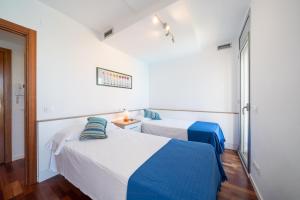 Posteľ alebo postele v izbe v ubytovaní Apartamento Luciana