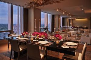 a dining room filled with tables and chairs at Four Seasons Hotel Toronto at Yorkville in Toronto