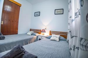 Postel nebo postele na pokoji v ubytování Chalet Migjorn Riumar Pura Natura