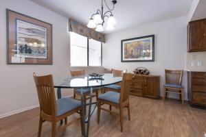 a dining room with a table and chairs at Casitas del Monte in Palm Springs