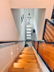 a staircase in a house with wooden floors at Central Austin modern home with large screened in porch in Austin