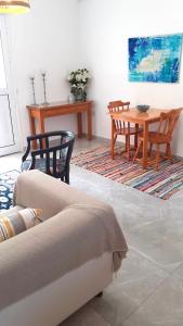 a living room with a couch and a table at Maria's Place in Polis Chrysochous