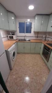 Kuchyň nebo kuchyňský kout v ubytování Fantástico apartamento con piscina en Tossa de Mar