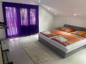 Postel nebo postele na pokoji v ubytování Villa Nur