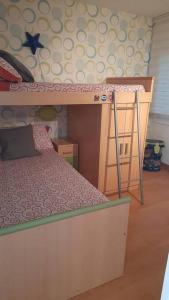 Postel nebo postele na pokoji v ubytování Fantástico apartamento con piscina en Tossa de Mar