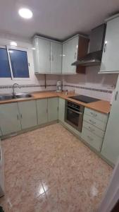 Kuchyň nebo kuchyňský kout v ubytování Fantástico apartamento con piscina en Tossa de Mar