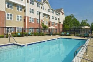 a swimming pool in front of a building at Residence Inn Baltimore White Marsh in Baltimore