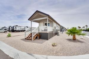 a small house with a porch and a staircase at Bullhead City Vacation Rental with Resort Pool! in Bullhead City