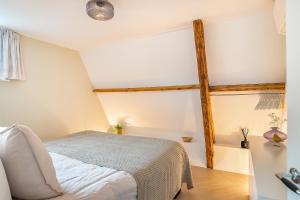 Un pat sau paturi într-o cameră la Nummertje50