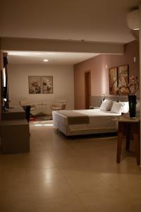 Ένα ή περισσότερα κρεβάτια σε δωμάτιο στο Bristol Infinity Rio Claro +44 φωτογραφίες